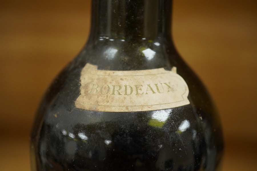 A bottle of Chateau Margaux 1934 Premier Grand Cru, Bordeaux, red wine. Condition - poor, level low and labels damaged, storage history unknown.